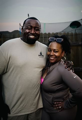Behind the scenes at RRL 2026, smiling pair by the fence at dusk