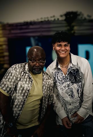 Evver the Thinker and Mr Durite at RRL 2026, two artists smiling together, one in patterned shirt and one in white embroidered shirt