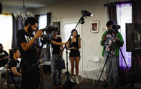 RRL Crew, video crew with cameras, tripods and boom light on set in the studio